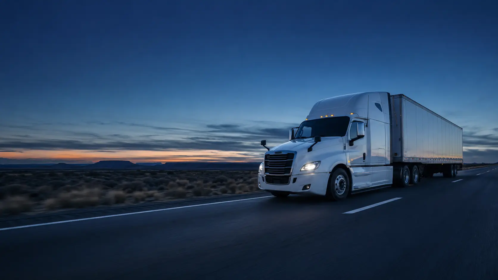 Semi truck on a highway at dusk